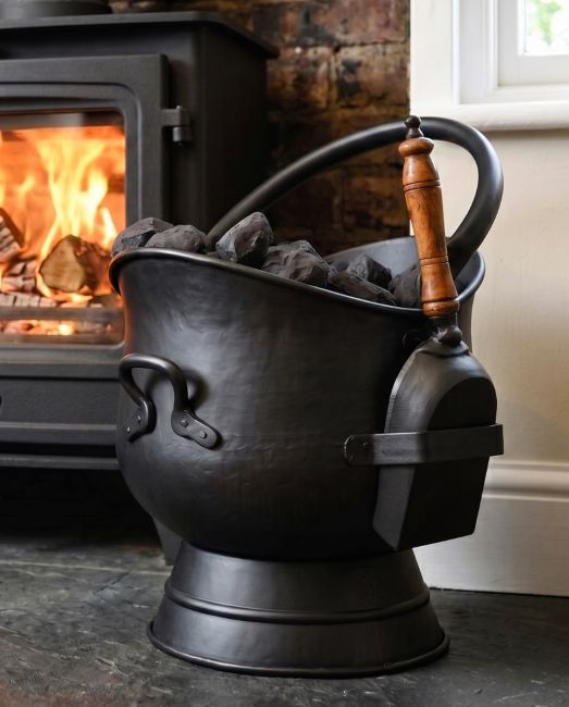 The "Brindleton" Coal Scuttles with Shovels Displayed in Front of a Lit Log Burner - Digital Illustration The "Brindleton" Coal Scuttles with Shovels Displayed in Front of a Lit Log Burner - Digital Illustration