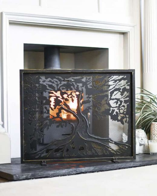 "Lignum Vitae" Brushed Gold Fire Guard In A Fireplace Setting "Lignum Vitae" Brushed Gold Fire Guard In A Fireplace Setting