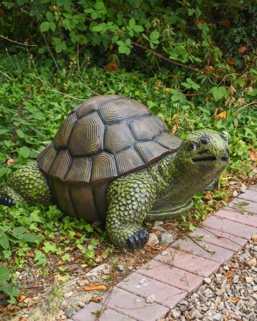 "Terrence" the Tortoise Fibreglass Garden Ornament on the Side of a Garden Gravel Path