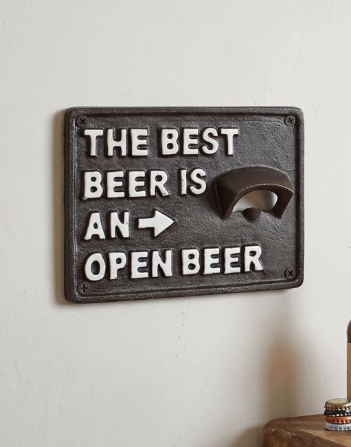 "The Best Beer Is An Open Beer" Cast Iron Bottle Opener Mounted on a White Wall in a Modern Home Interior - Digital Illustration