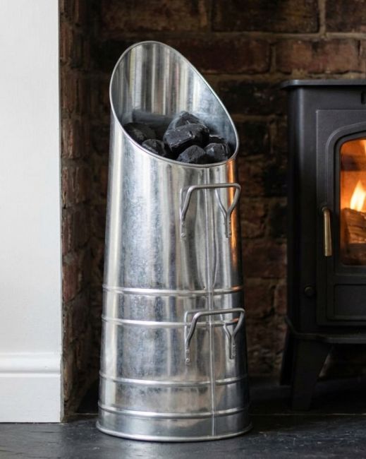 The "The Industrial Mod" Coal Hod Unpainted Version in a Contemporary Home in Front of a Fireplace - Digital Illustration The "The Industrial Mod" Coal Hod Unpainted Version in a Contemporary Home in Front of a Fireplace - Digital Illustration