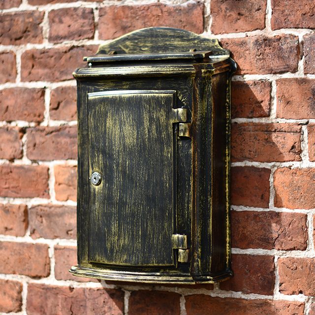 Beautiful Antique classic post box on brick wall Beautiful Antique classic post box on brick wall