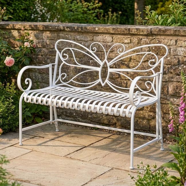 "Papillon" Contemporary Wrought Iron Two Seater Garden Bench with Lady Sat on Seat for Scale "Papillon" Contemporary Wrought Iron Two Seater Garden Bench with Lady Sat on Seat for Scale