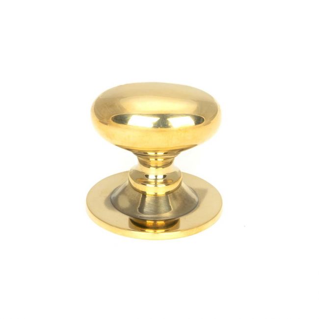 The Aged Brass 33mm Traditional Oval Cabinet Knob Shown Upright on a White Background 