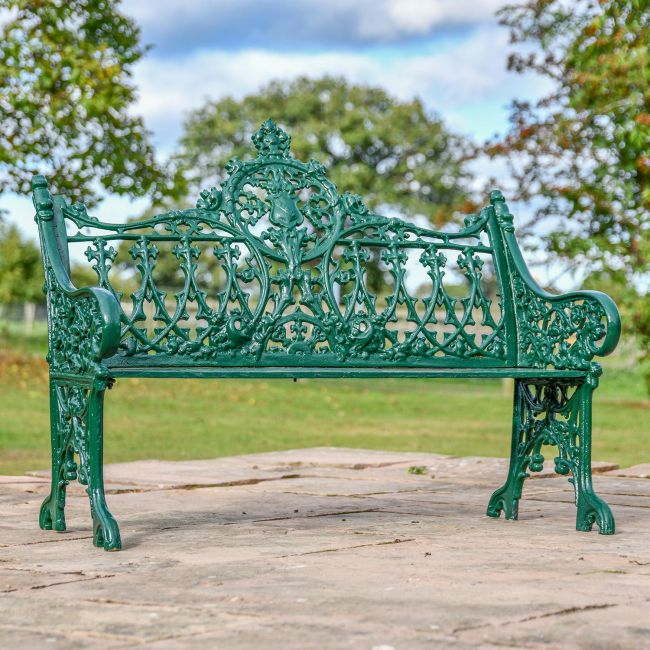 Green Cast Iron Gothic Garden Bench in Use in the garden Green Cast Iron Gothic Garden Bench in Use in the garden