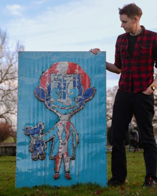 "The Silent Comedian" Oil Drum Scrap Metal Wall Art blue background "The Silent Comedian" Oil Drum Scrap Metal Wall Art blue background