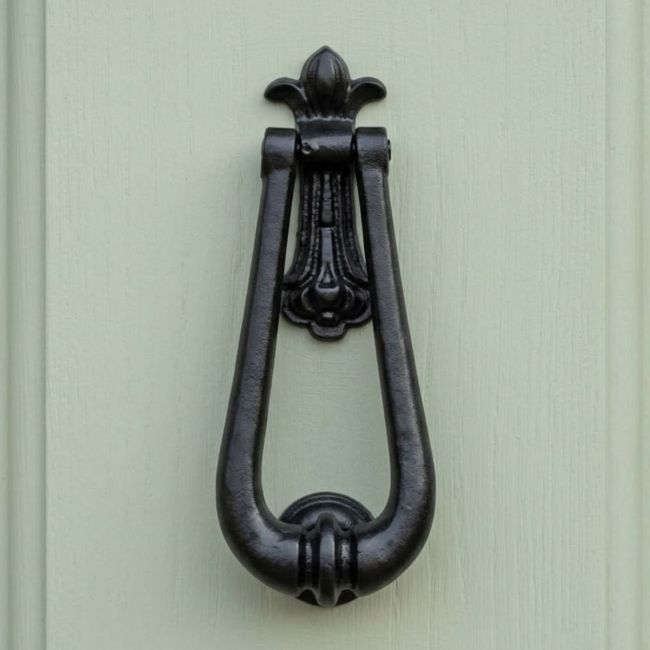 The Black Antique Fleur-de-Lis Door Knocker - 195mm Traditional Pear Drop Fastener on a White Background