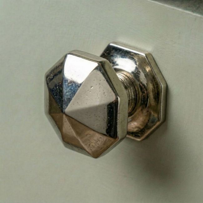 A 39mm Cast Iron Octagonal Cabinet Knob Fitted to a Contemporary Green Kitchen Cupboard Door - Digital Illustration