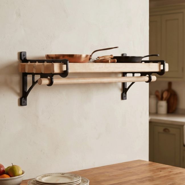 A Cast Iron & Wooden Storage Shelf Mounted on a Cream Wall in a Modern Kitchen - Digital Illustration