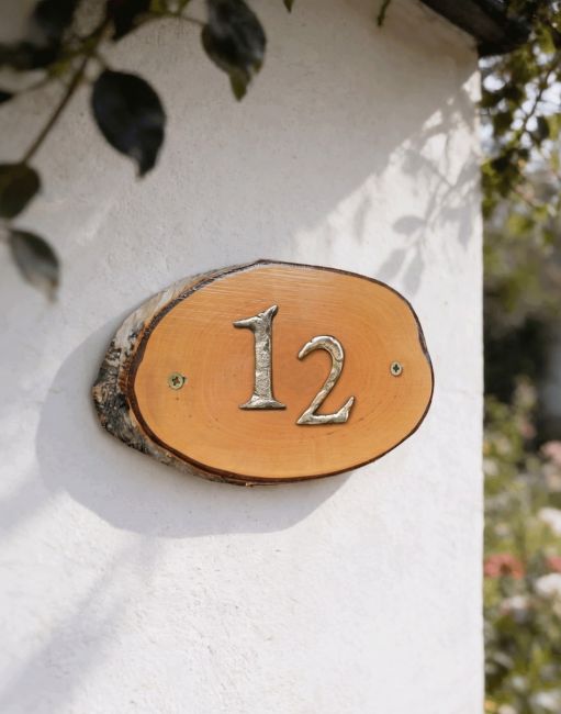 A Number 12 Natural Hard Wood Rustic House Number Sign Mounted on a Sunny Cottage Wall - Digital Illustration A Number 12 Natural Hard Wood Rustic House Number Sign Mounted on a Sunny Cottage Wall - Digital Illustration