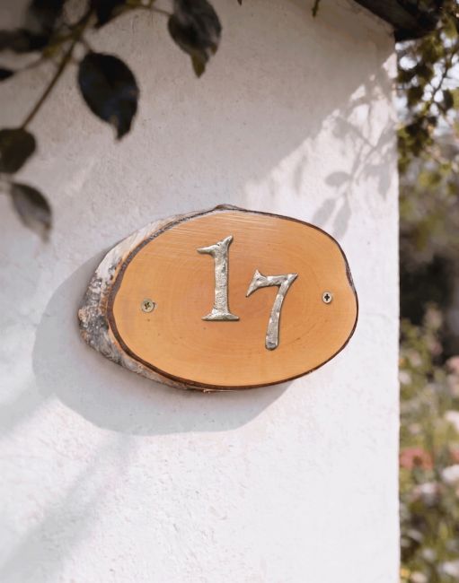 A Number 17 Natural Hard Wood Rustic House Number Sign Mounted on a Sunny Cottage Garden Wall - Digital Illustration A Number 17 Natural Hard Wood Rustic House Number Sign Mounted on a Sunny Cottage Garden Wall - Digital Illustration