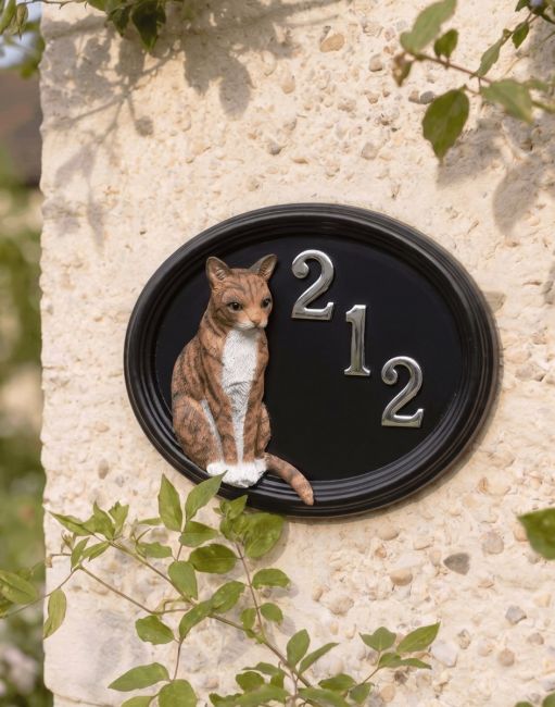 A Number 212 "Marmalade" Hand Painted Thomas Cat House Sign Mounted on a Textured White Cottage Wall - Digital Illustration 