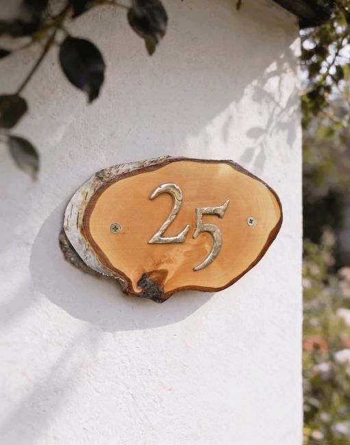 A Number 25 Natural Hard Wood Rustic House Number Sign Mounted on a Sunny Garden Cottage Wall - Digital Illustration A Number 25 Natural Hard Wood Rustic House Number Sign Mounted on a Sunny Garden Cottage Wall - Digital Illustration