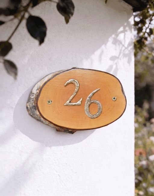 A Number 26 Natural Hard Wood Rustic House Number Sign Mounted on a Sunny Garden Cottage Wall - Digital Illustration A Number 26 Natural Hard Wood Rustic House Number Sign Mounted on a Sunny Garden Cottage Wall - Digital Illustration