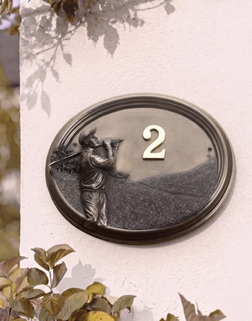 A Number 2 "Birkdale Park" Golfer House Number Sign in a Bronze Finish Mounted on a Cream Coloured Cottage Wall - Digital Illustration