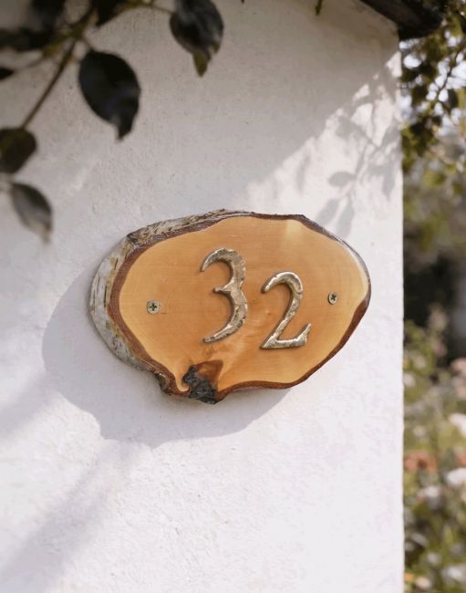 A Number 32 Natural Hard Wood Rustic House Number Sign Mounted on a Cream Coloured Cottage Wall - Digital Illustration A Number 32 Natural Hard Wood Rustic House Number Sign Mounted on a Cream Coloured Cottage Wall - Digital Illustration
