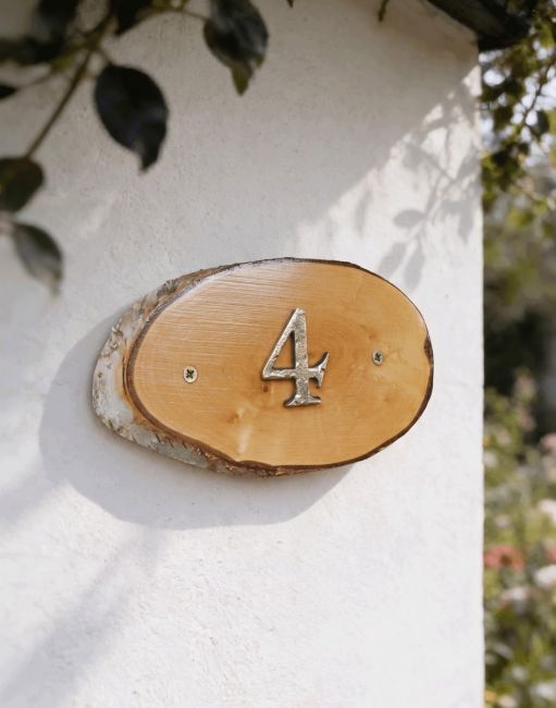 A Number 4 Natural Hard Wood Rustic House Number Sign Mounted on a White Coloured Cottage Garden Wall - Digital Illustration A Number 4 Natural Hard Wood Rustic House Number Sign Mounted on a White Coloured Cottage Garden Wall - Digital Illustration