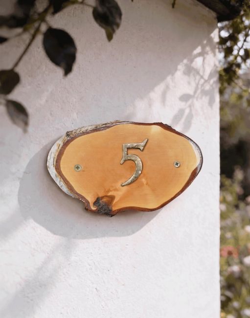 A Number 5 Natural Hard Wood Rustic House Number Sign Mounted on a Sunny Garden Cottage Wall - Digital Illustration A Number 5 Natural Hard Wood Rustic House Number Sign Mounted on a Sunny Garden Cottage Wall - Digital Illustration