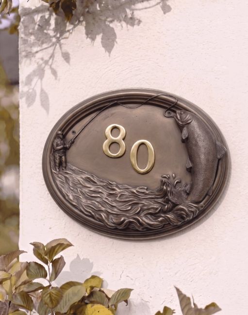 A Number 80 "Docklow Valley" Fisherman House Number Sign in a Bronze Finish Mounted on a Cream Coloured Cottage Wall - Digital Illustration A Number 80 "Docklow Valley" Fisherman House Number Sign in a Bronze Finish Mounted on a Cream Coloured Cottage Wall - Digital Illustration