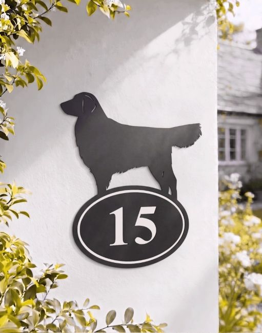 A Number 15 Golden Retriever Iron House Number Sign Mounted on a White Wall in Front of a Countryside Property - Digital Illustration 