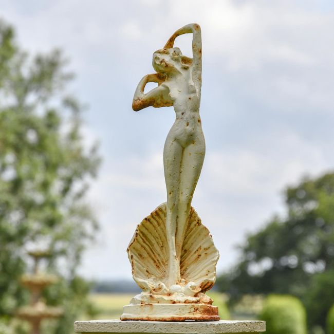 Lady Standing on Clam Sculpture in Situ