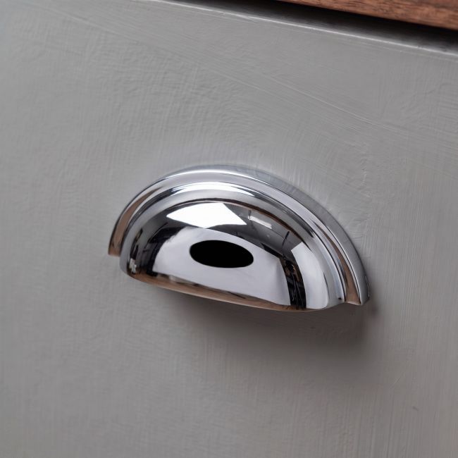 The Art Deco Concealed Cup Drawer Pull in Polished Chrome on a White Background 