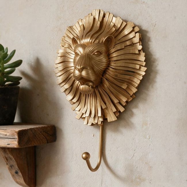 Artistic Gold Lion Hook in Situ on a Brick Wall Artistic Gold Lion Hook in Situ on a Brick Wall