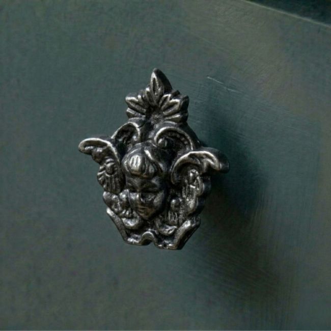 An Iron Fairy Cabinet Knob Fitted onto a Contemporary Blue Kitchen Cupboard - Digital Illustration 