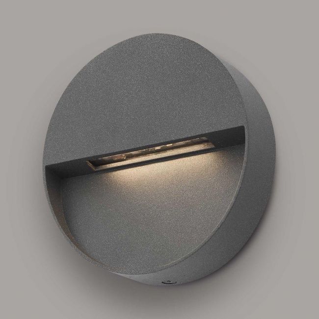 Round Eye-Lid Style Wall Light in Situ on a Grey Wall Round Eye-Lid Style Wall Light in Situ on a Grey Wall