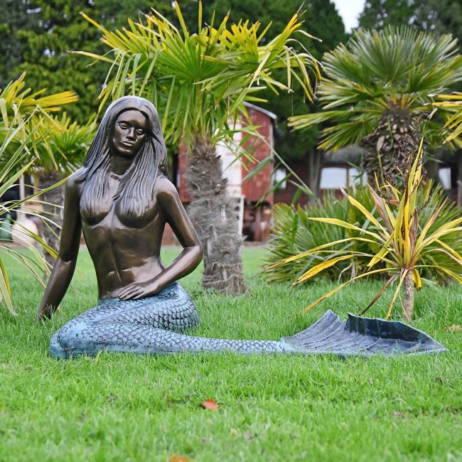 Antique Bronze Mermaid Garden Sculpture in Situ in the Garden Antique Bronze Mermaid Garden Sculpture in Situ in the Garden