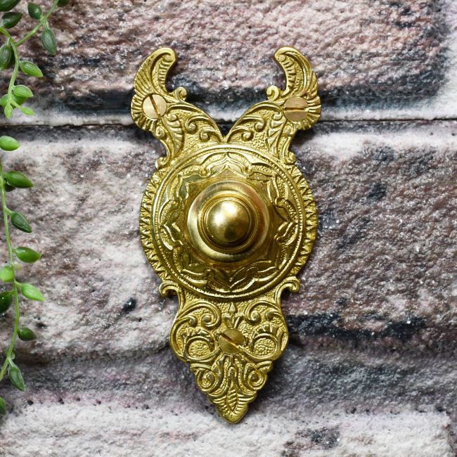 Polished brass old fashioned front door buzzer Polished brass old fashioned front door buzzer