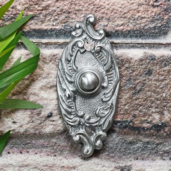 Satin Chrome Bell push on brick wall Satin Chrome Bell push on brick wall