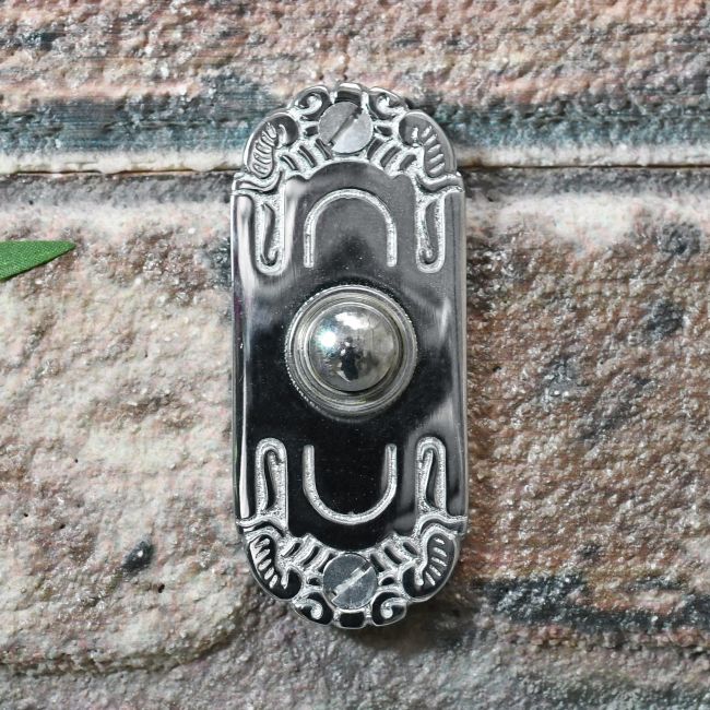 Beautiful art Nouveau inspired door bell on brick wall Beautiful art Nouveau inspired door bell on brick wall