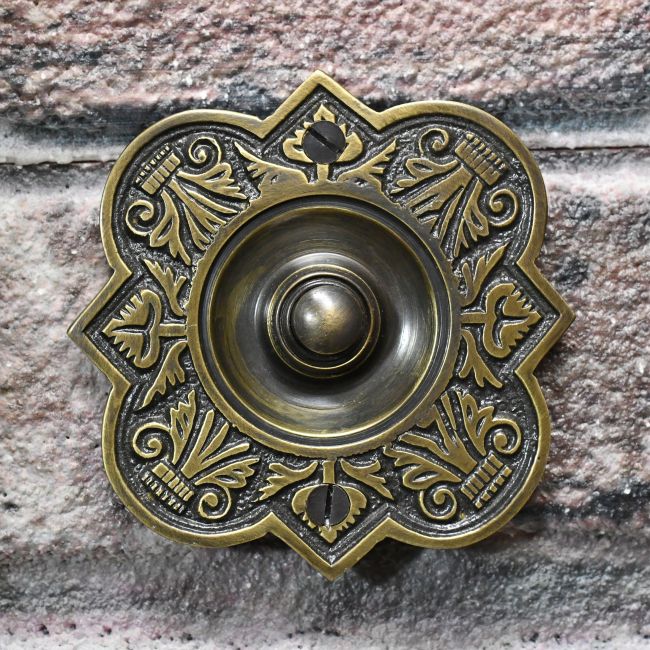 Antique Brass Period Door Bell on brick Wall Antique Brass Period Door Bell on brick Wall