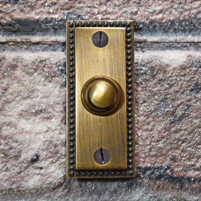 Antique Brass Georgian style bell Push on brick wall Antique Brass Georgian style bell Push on brick wall