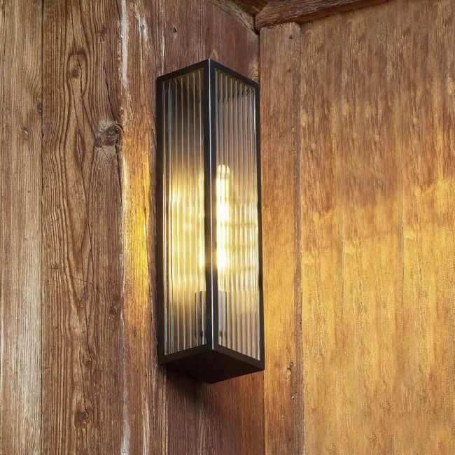 Bronze Reeded Glass Wall Light in Situ on a Wooden Wall Bronze Reeded Glass Wall Light in Situ on a Wooden Wall