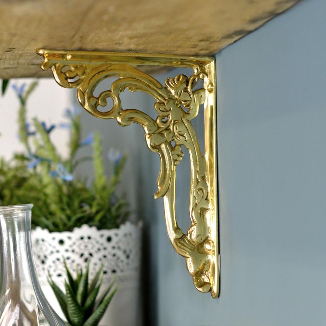 Polished Brass Scroll Bracket in Situ Polished Brass Scroll Bracket in Situ