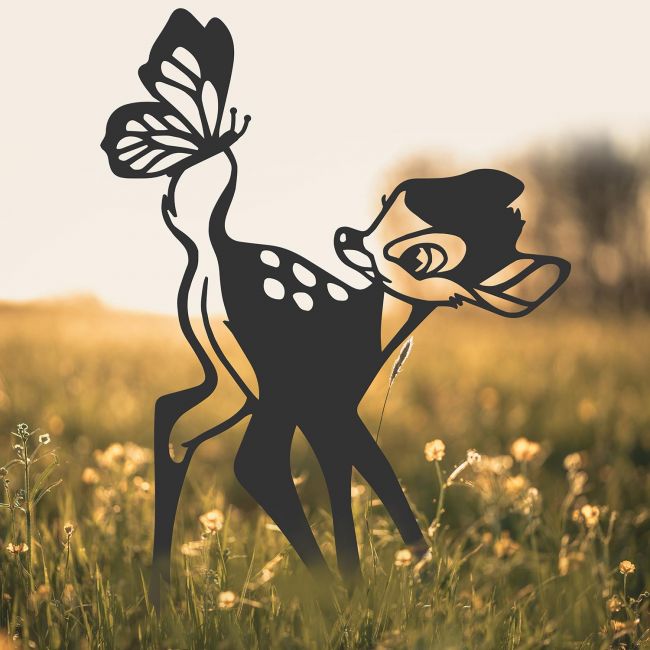 Black Cartoon Deer Silhouette in Situ in a Field Black Cartoon Deer Silhouette in Situ in a Field