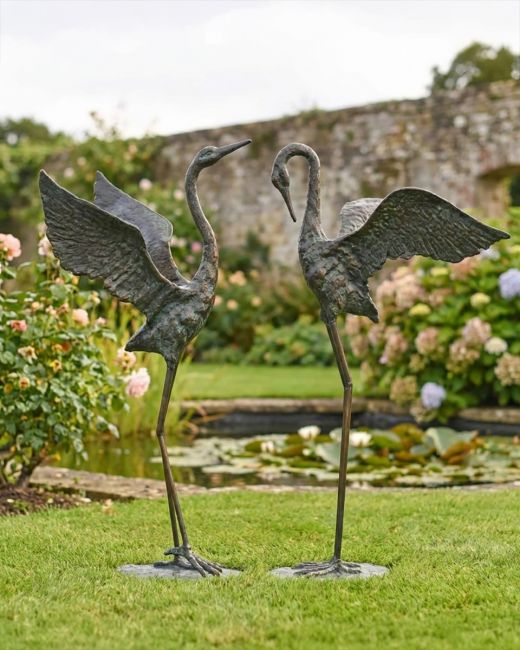 Cast Iron Freestanding "Fighting Flamingos" Garden Sculpture - Set of Two ai illustration