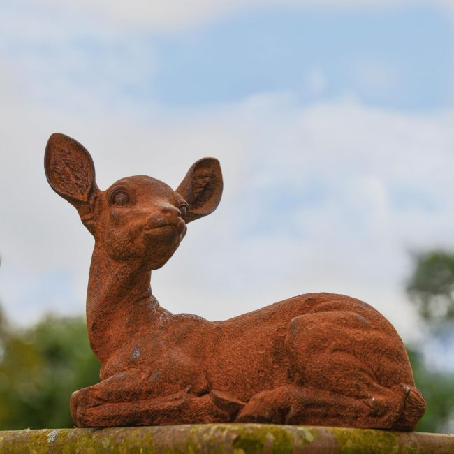 Rustic Cast Iron Sitting Deer Sculpture - Facing Left