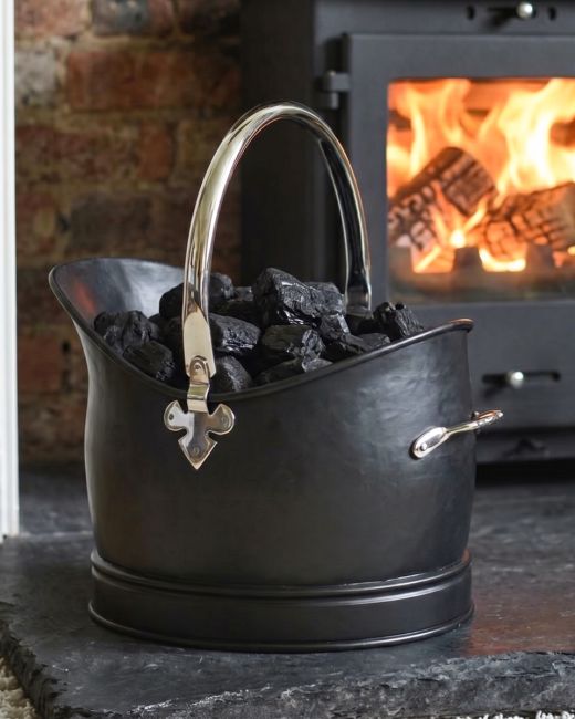 The 27.5cm "Hinswick" Victorian Black Iron and Nickel Coal Bucket Positioned Next to a Decorative Fireplace - Digital Illustration The 27.5cm "Hinswick" Victorian Black Iron and Nickel Coal Bucket Positioned Next to a Decorative Fireplace - Digital Illustration