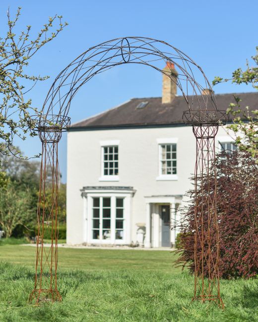 "Alauna" Natural Lacquer Rose Arch in Situ in the Garden "Alauna" Natural Lacquer Rose Arch in Situ in the Garden