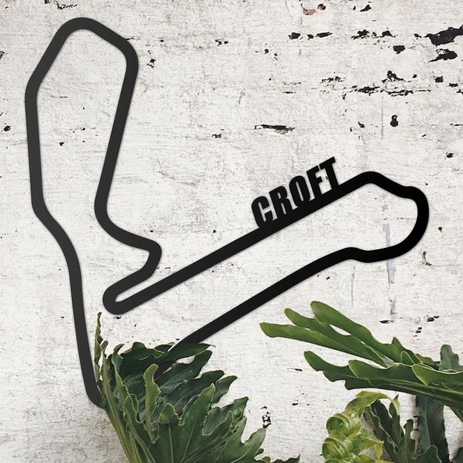 Croft Race Track on Display on a Rustic White Wall Croft Race Track on Display on a Rustic White Wall