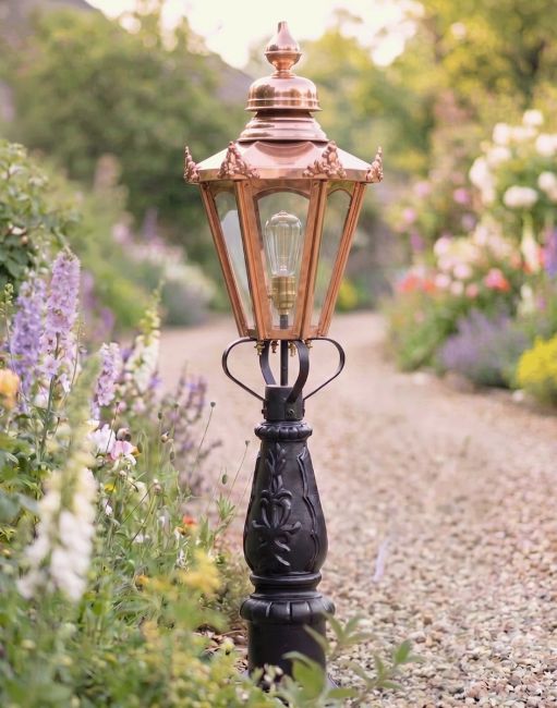 Digital Illustration 105cm Copper Concordia Patio or Driveway Lighting Positioned on a Flowery Gravel Driveway