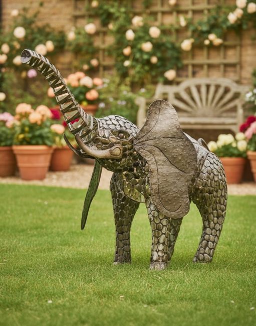 Digital Illustration of "Sambaku" Bronze Garden Elephant Sculpture Looking Up in Front of a Flowering Garden