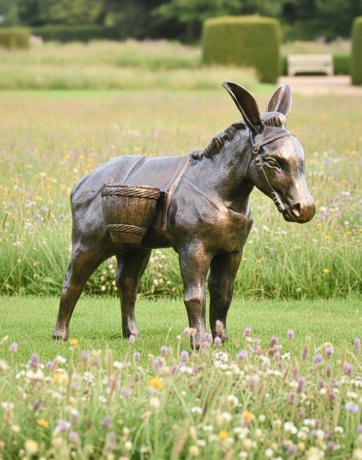 Digital illustration of Antique Bronze Travelling Donkey Sculpture in a meadow garden