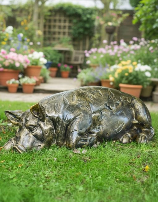 Digital illustration of a "Penelope" the Sleeping Pig Garden Sculpture positioned on a garden lawn