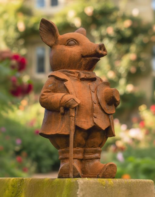 Digital illustration of a Rustic Cast Iron "Sophisticated Gentleman" Pig Garden Sculpture in a cottage rose garden