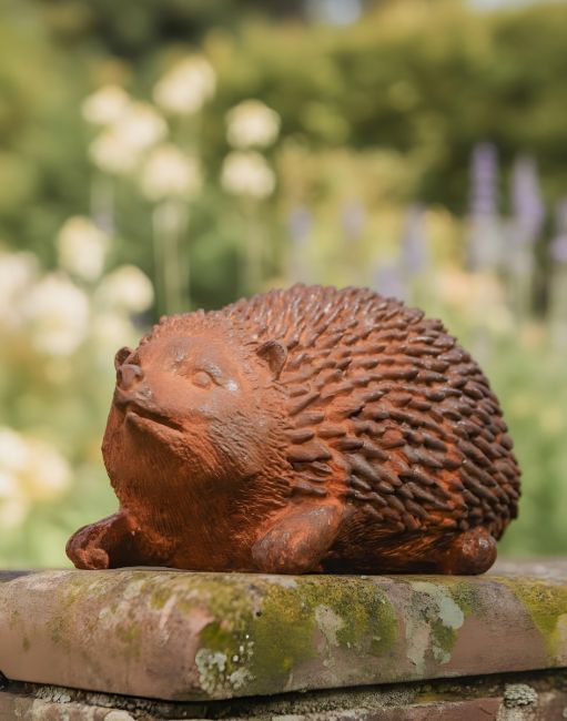 Digital illustration of Rustic Cast Iron Hedgehog Sculpture on garden wall
