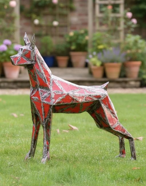 Digital Illustration of ‘Spark’ Upcycled Oil Drum Garden Sculpture on a Grass Lawn in Front of Flower Pots